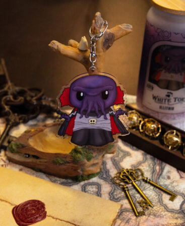Mind Flayer Acrylic keychain hanging from branch